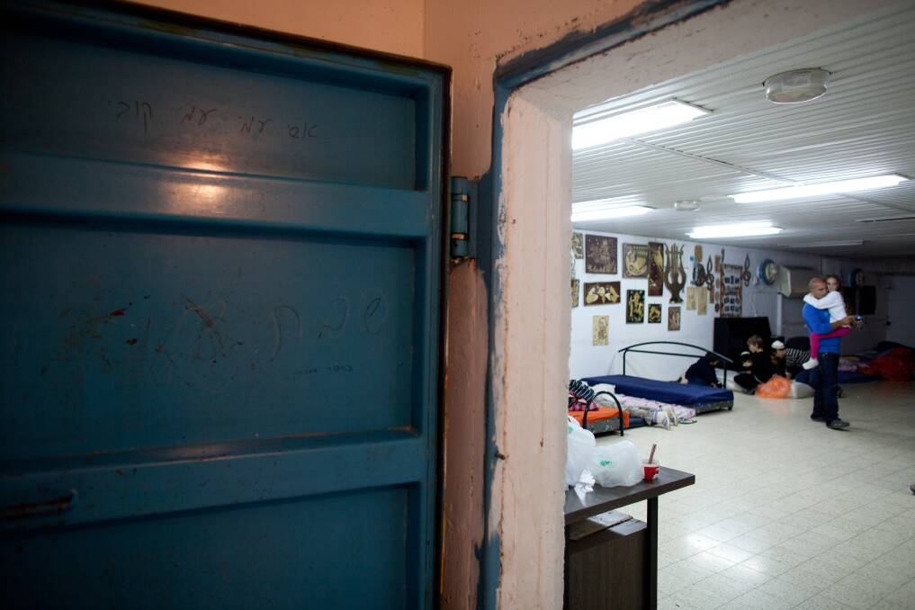 Israelis stay in a bomb shelter on November 14, 2012 in Netivot, Israel. Photo by Uriel Sinai/Getty Images