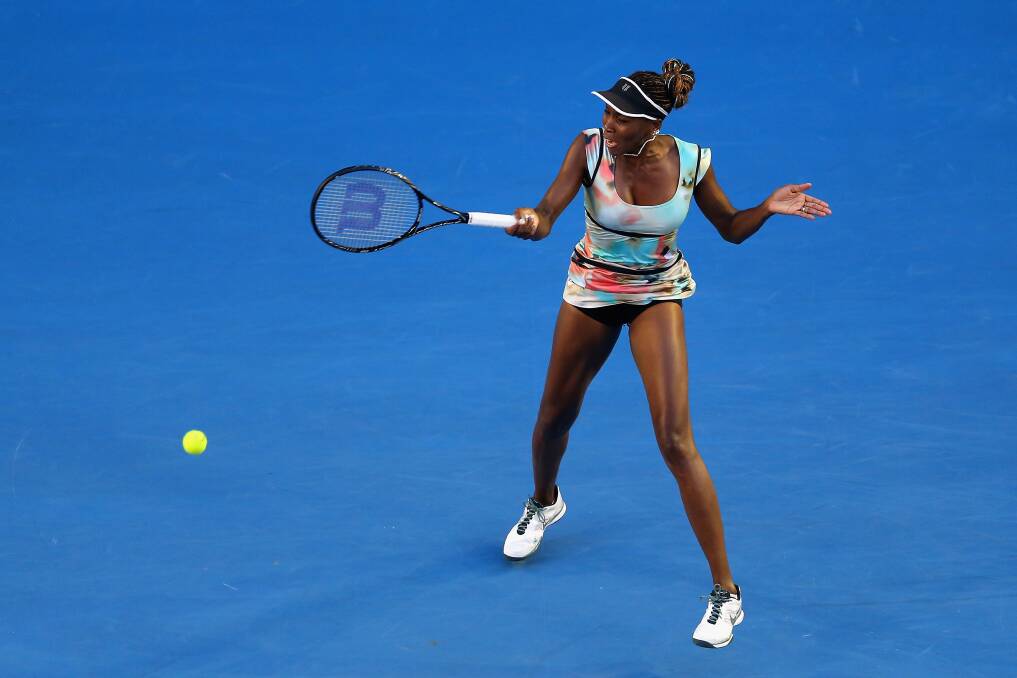 Venus Williams of the United States plays a forehand in her second round match against Alize Cornet of France. Photo by Julian Finney/Getty Images