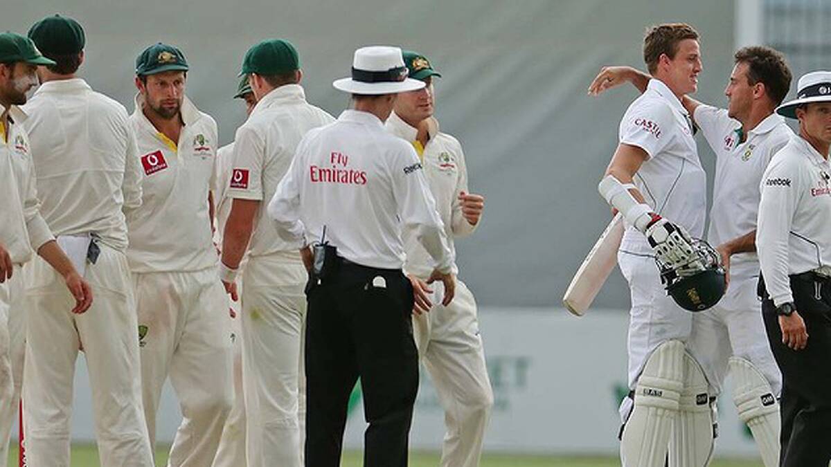 Faf du Plessis and Morne Morkel of South Africa embrace at the conclusion of day five. Photo: Getty Images