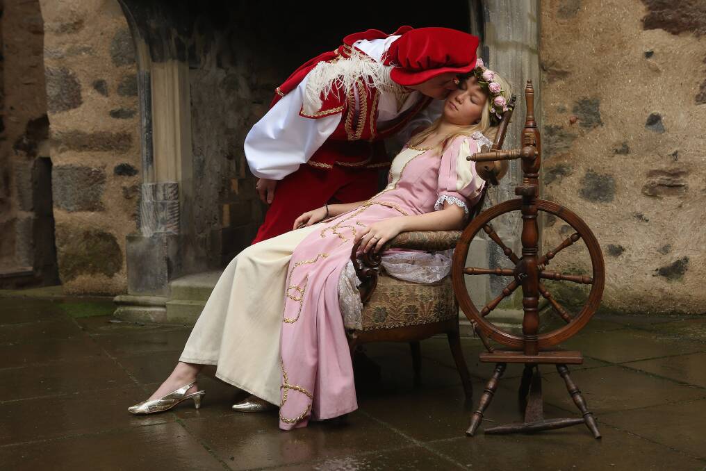 Prince Charming, actually actor Andreas Richhardt, supports Sleeping Beauty, played by actress Elisabeth Knoche, at Sababurg Palace near Hofgeismar, Germany. Photo by Sean Gallup/Getty Images