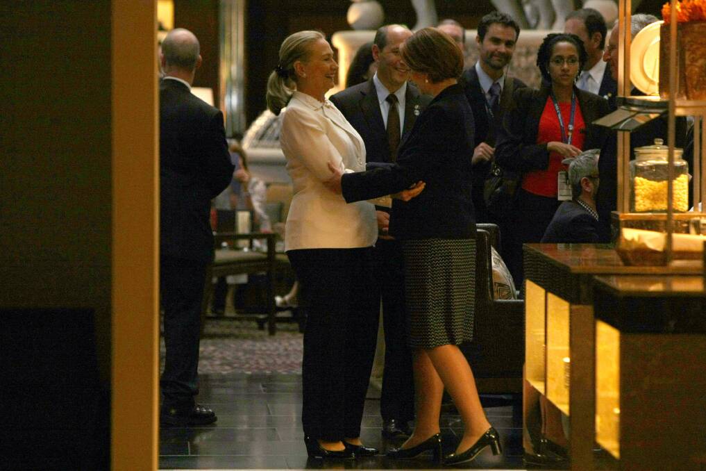 Australian Prime Minister Julia Gillard and US Secretary of State Hillary Clinton greet each other in the bar of the Hyatt Hotel prior to the Australia-United States Ministerial Consultations in Perth, Australia. Photo by Colin Murty - Pool Getty Images